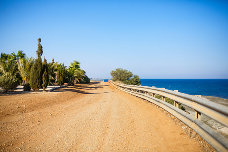 Curving dirt road near the Mediterranean sea, Cyprus.の写真素材