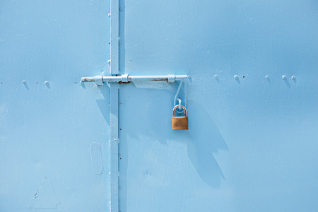 Closeup metal door with lock in blue color. Texture.の写真素材