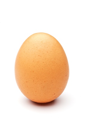 one raw egg in a studio shot on white backgroundの写真素材