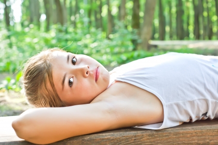 Girl rests on the benchの写真素材