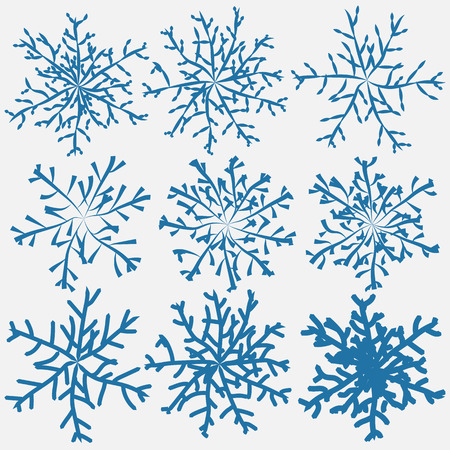 Blue colored winter snowflakes collection handdrawn with brushes. Vector illustration.のイラスト素材