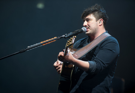 PRAGUE, CZECH REPUBLIC - MAY 20, 2016: Singer and guitarist Marcus Mumford of Mumford and Sons During a performance in Prague, Czech Republic, May 20, 2016.のeditorial素材
