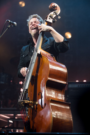 PRAGUE, CZECH REPUBLIC - MAY 20, 2016: Bassist Ted Dwane of Mumford and Sons During a performance in Prague, Czech Republic, May 20, 2016.のeditorial素材