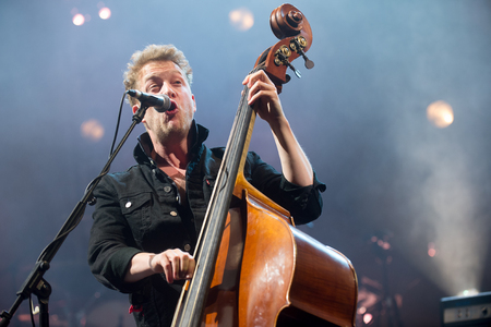 PRAGUE, CZECH REPUBLIC - MAY 20, 2016: Bassist Ted Dwane of Mumford and Sons During a performance in Prague, Czech Republic, May 20, 2016.のeditorial素材