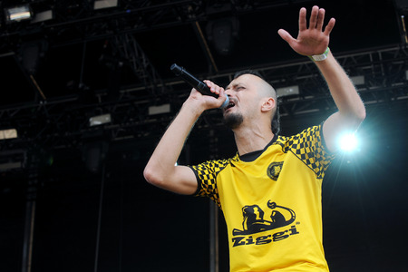 Hradec Kralove, CZECH REPUBLIC - JULY 3, 2015: Singer Almir Hasanbegovic of Bosnian band dubioza kolektiv During a performance at Rock for People festival in Hradec Kralove, Czech Republic, July 3, 2015.のeditorial素材