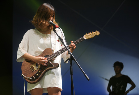 Hradec Kralove, CZECH REPUBLIC - JULY 4, 2014: Singer Ikkyu Nakajima of Tricot band During a performance at the Rock for People festival in Hradec Kralove, Czech Republic, July 4, 2014.のeditorial素材