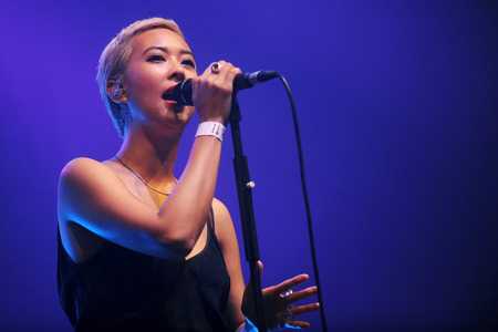 Hradec Kralove, CZECH REPUBLIC - JULY 5, 2014: Singer Alisa Xayalith of The Naked and Famous During a performance at the Rock for People festival in Hradec Kralove, Czech Republic, July 5, 2014.のeditorial素材