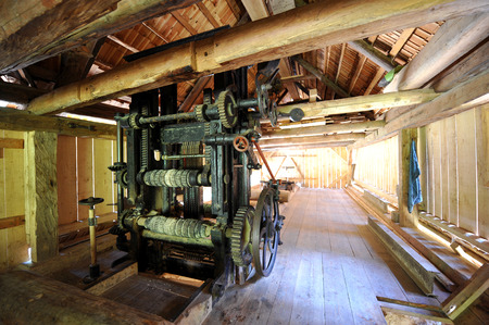 Machine in a traditional sawmillの写真素材
