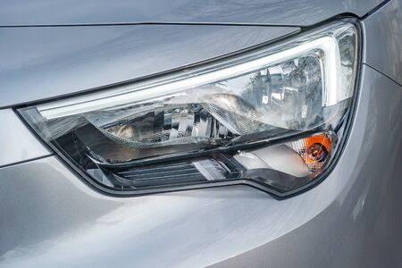 Front light of a silver car