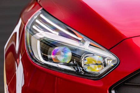 Front light of a red car, LED technology