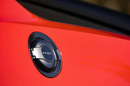 Fuel tank cap on new red car