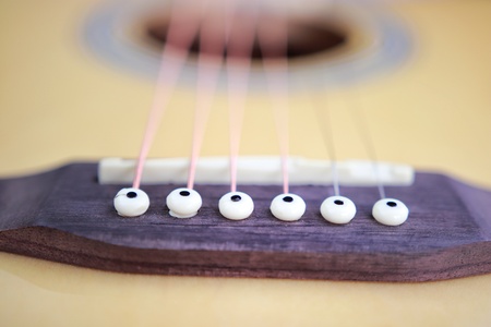 Acoustic guitar strings on white background close up top view with empty space for you textの写真素材