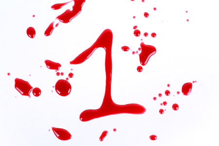 Bloody print on a white background with the letters 1の写真素材