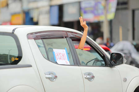 Nakhonratchasima, Thailand - July 23, 2021 : Car mob street of Thailand people took to the streets to protest against the military coup Protesters to show symbolic gestures at democracy.のeditorial素材