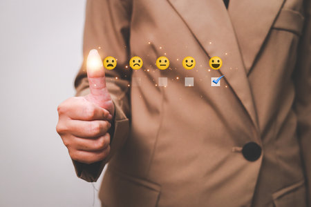 Customer pressing satisfaction with gold five star rating feedback icon and press level excellent rank for giving best score point to review the service , experience success business rate  concept.の写真素材