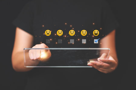 Customer pressing satisfaction with gold five star rating feedback icon and press level excellent rank for giving best score point to review the service , experience success business rate  concept.の写真素材