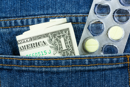 pills and banknote in  jean pocketの写真素材