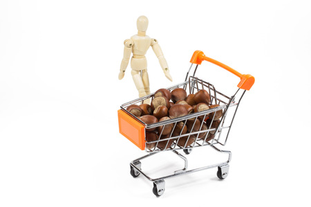 hazelnuts in shopping cartの写真素材