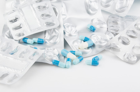 medicine pills and empty packets of prescriptionの写真素材