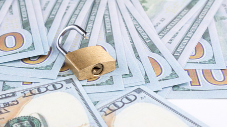 open padlock and moneyの写真素材