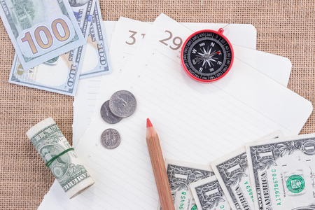 Compass and moneys on paperの写真素材
