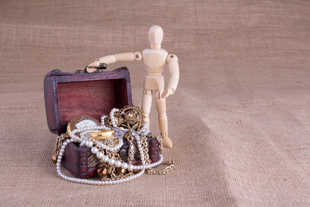 Wooden Mannequin with Jewelry Chestの写真素材
