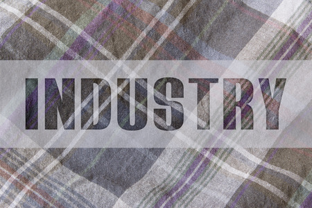 INDUSTRY written on plaid fabricの写真素材