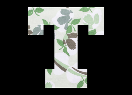 Letter T â with flowery fabric texture on black backgroundの写真素材