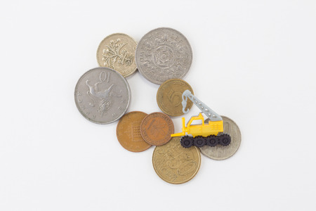 Miniature crane with coinsの写真素材