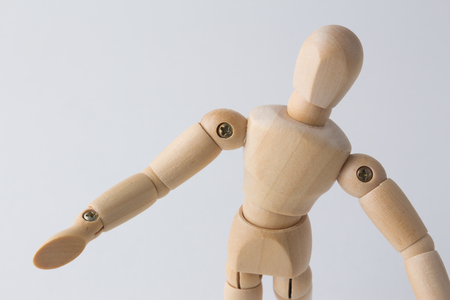 Wooden mannequin looking upの写真素材