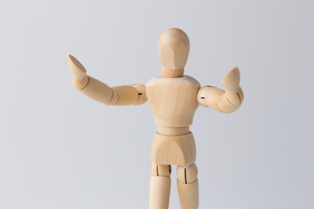 Wooden figure doll with open armsの写真素材