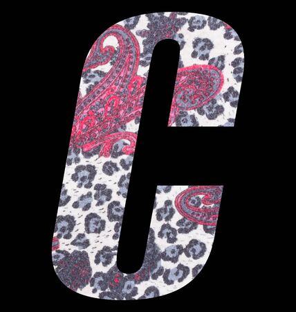 Letter C alphabet with floral fabric texture on black backgroundの写真素材