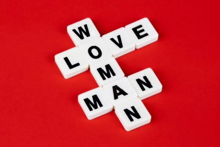 man, woman and love words on red backgroundの写真素材