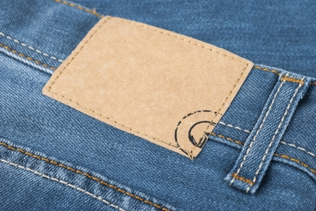 close up photograph of one pair of blue jeans and labelの写真素材