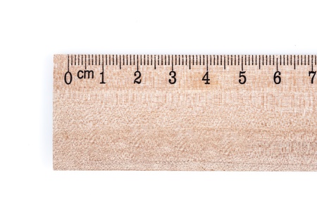 close up photo of wooden ruler on white background