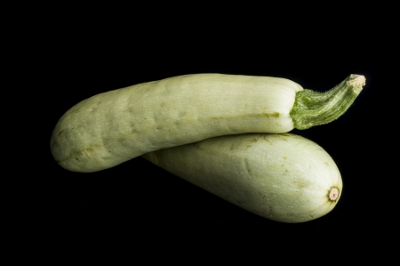 Fresh vegetable marrow. Isolated on black backgroundの写真素材