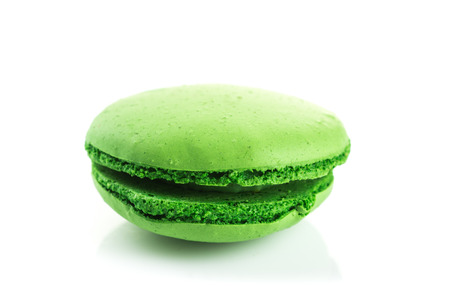 green Tasty colorful macaroon with kiwi flavor on white backgroundの写真素材