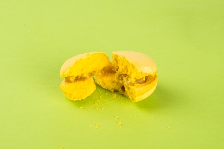yellow tasty broken macaroon with lemon flavorの写真素材