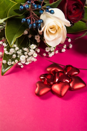 Red and white roses bouquet isolated on the pink の写真素材