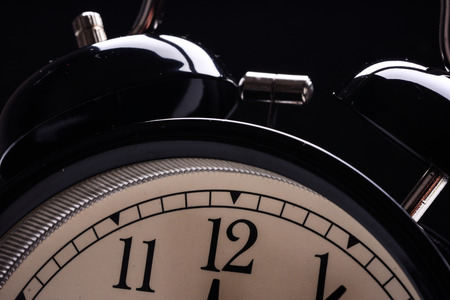 alarm clock showing different timesの写真素材