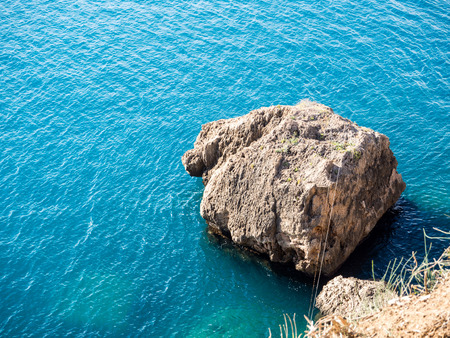 rock formation cliffs on the sea with beautiful light on rock facesの写真素材
