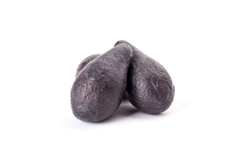 Three brown avocados isolated on white backgroundの写真素材