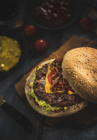 Tasty homemade burger served with different sauces top viewの写真素材