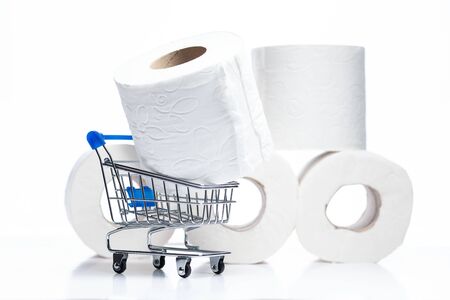 Grocery shopping cart with Toilet Paper rolls behind.の写真素材