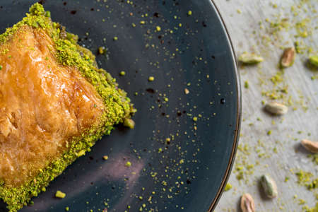 Turkish coffee and Traditional Turkish dessert in plate on wooden tableの写真素材