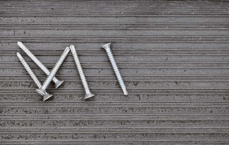 Close up of composite decking with screws
