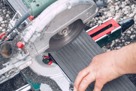 Miter saw. Cutting of composite deck. Shavings.の写真素材