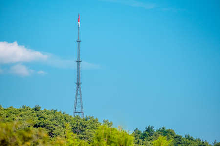 Telecommunication tower with signal amplifiers for mobile communications and antennas is installed...