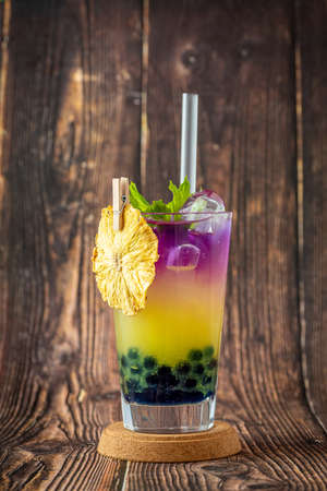 Fruity Bubble Tea in glass cup on wooden backgroundの写真素材
