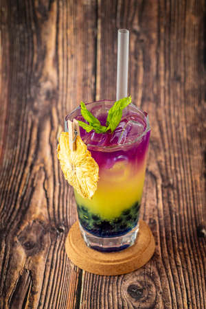 Fruity Bubble Tea in glass cup on wooden backgroundの写真素材